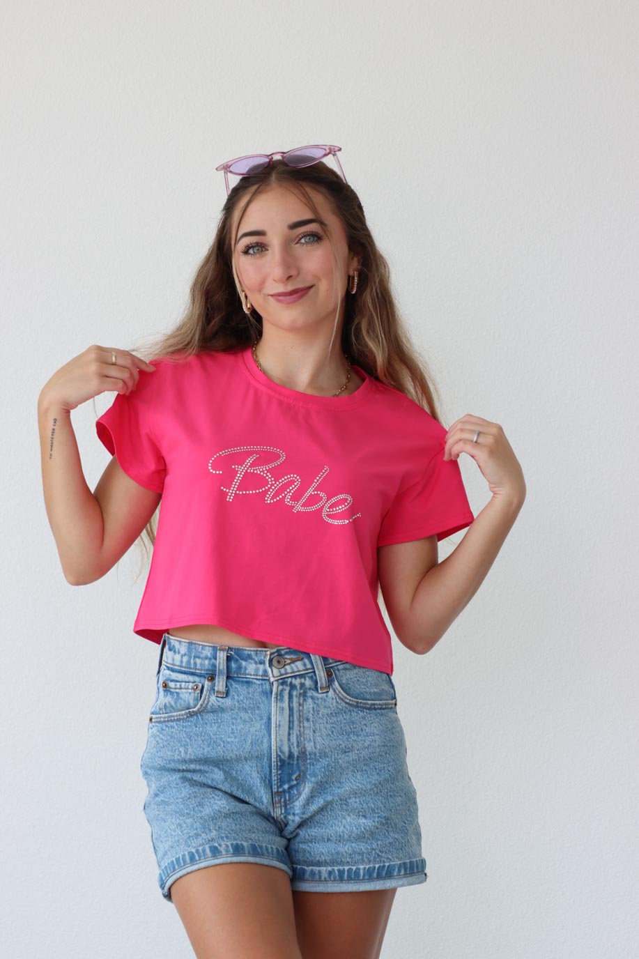 girl wearing hot pink "babe" t-shirt