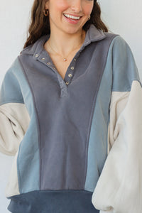 girl wearing blue, gray, and cream pullover