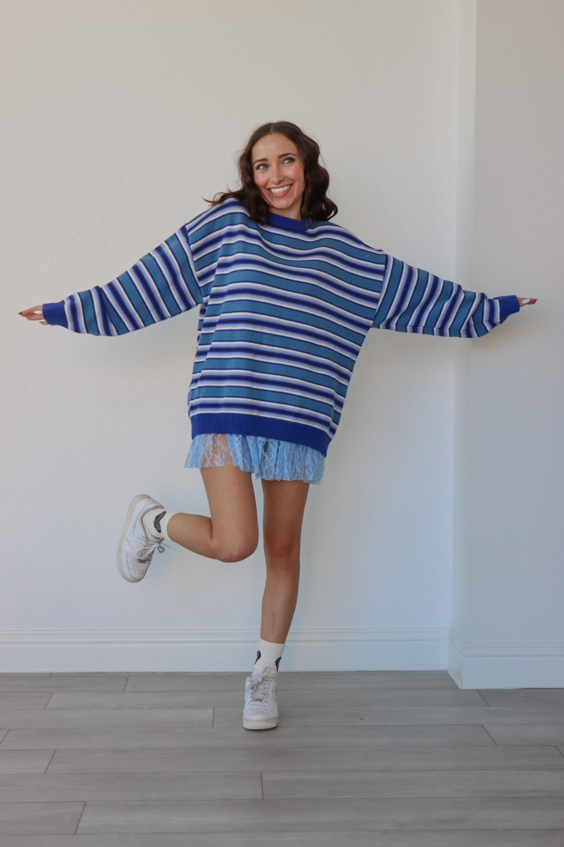 girl wearing blue striped sweater