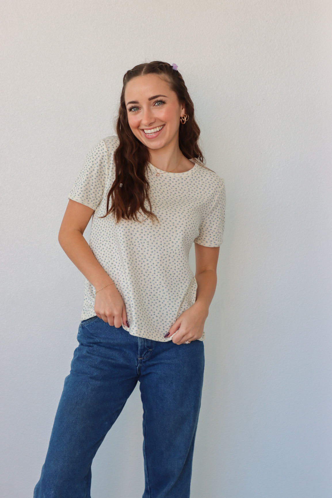 girl wearing white t-shirt with light blue floral pattern