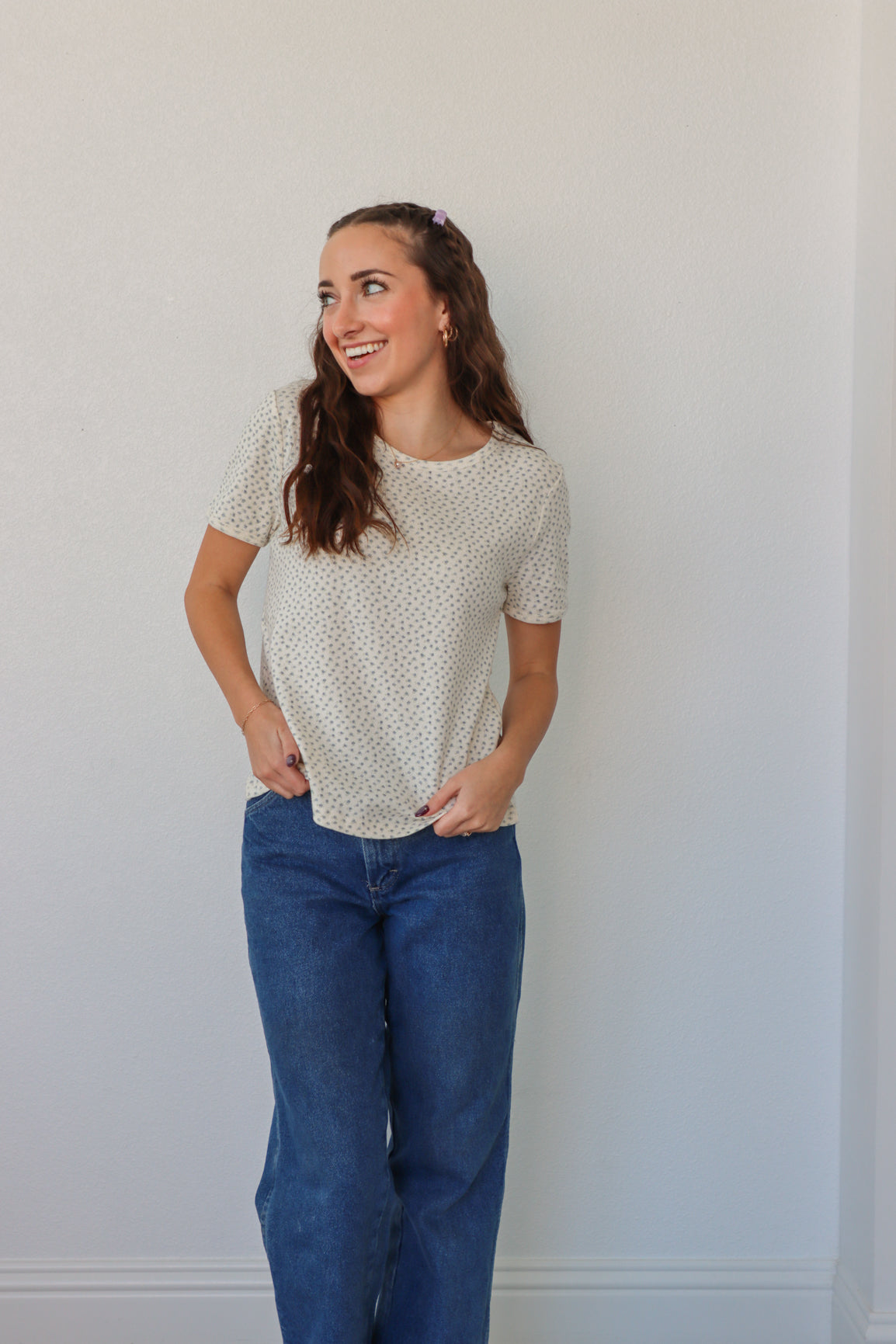 girl wearing white t-shirt with light blue floral pattern