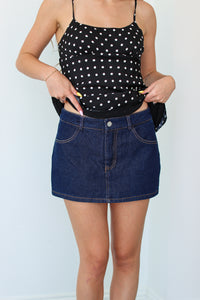 Woman wearing a denim mini skort 