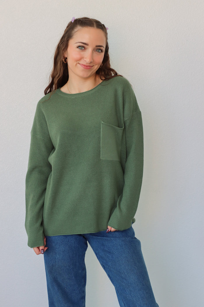 girl wearing emerald green sweater