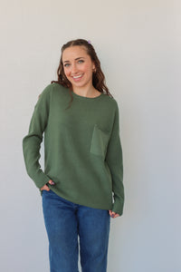 girl wearing emerald green sweater