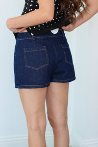 Close up of the back of a denim mini skort 