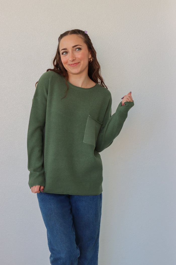 girl wearing emerald green sweater