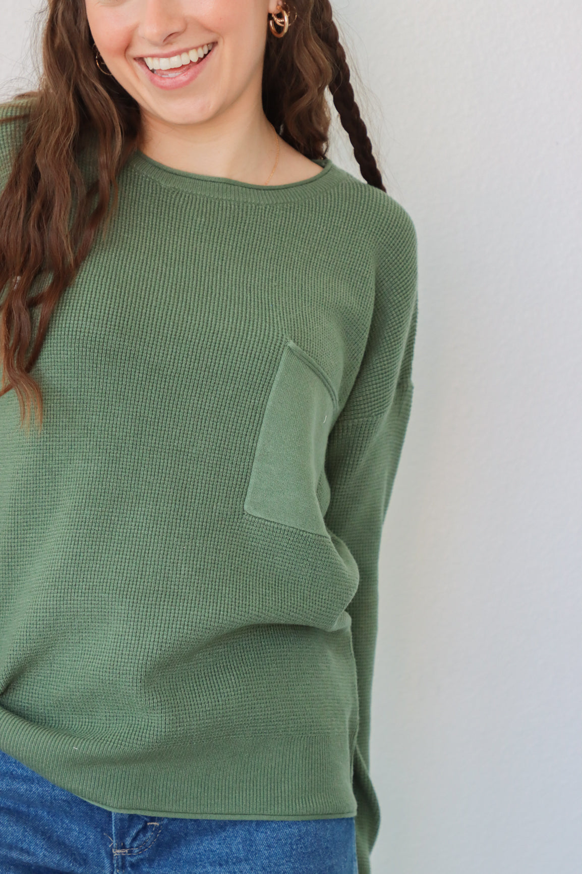 girl wearing emerald green sweater