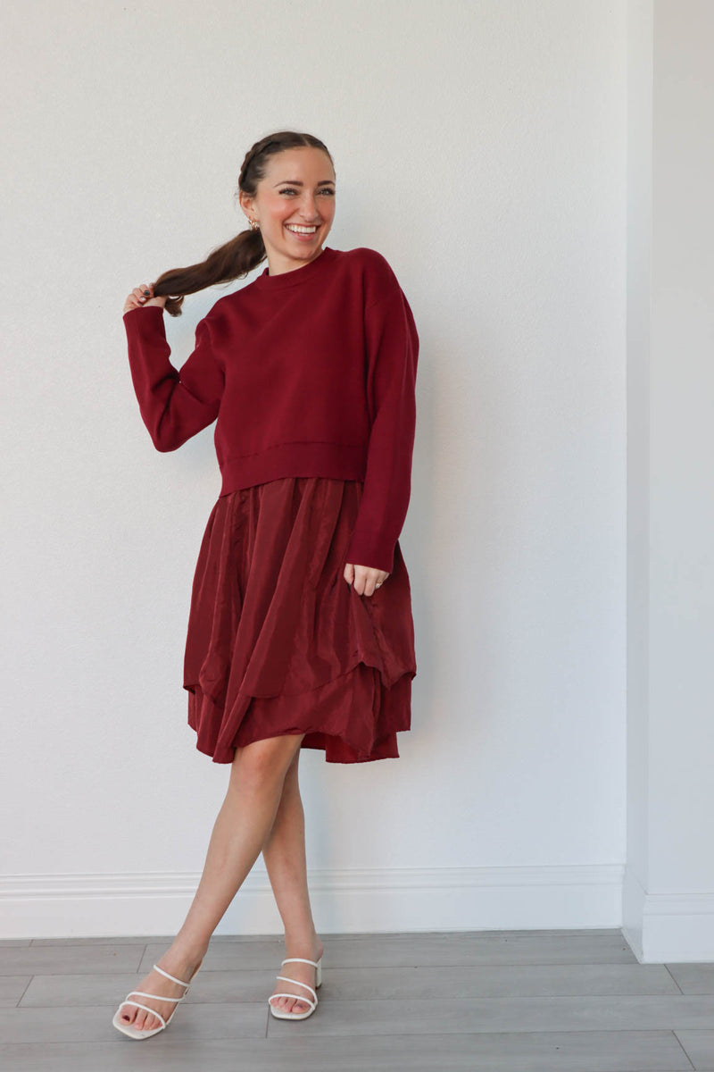 girl wearing red sweater dress