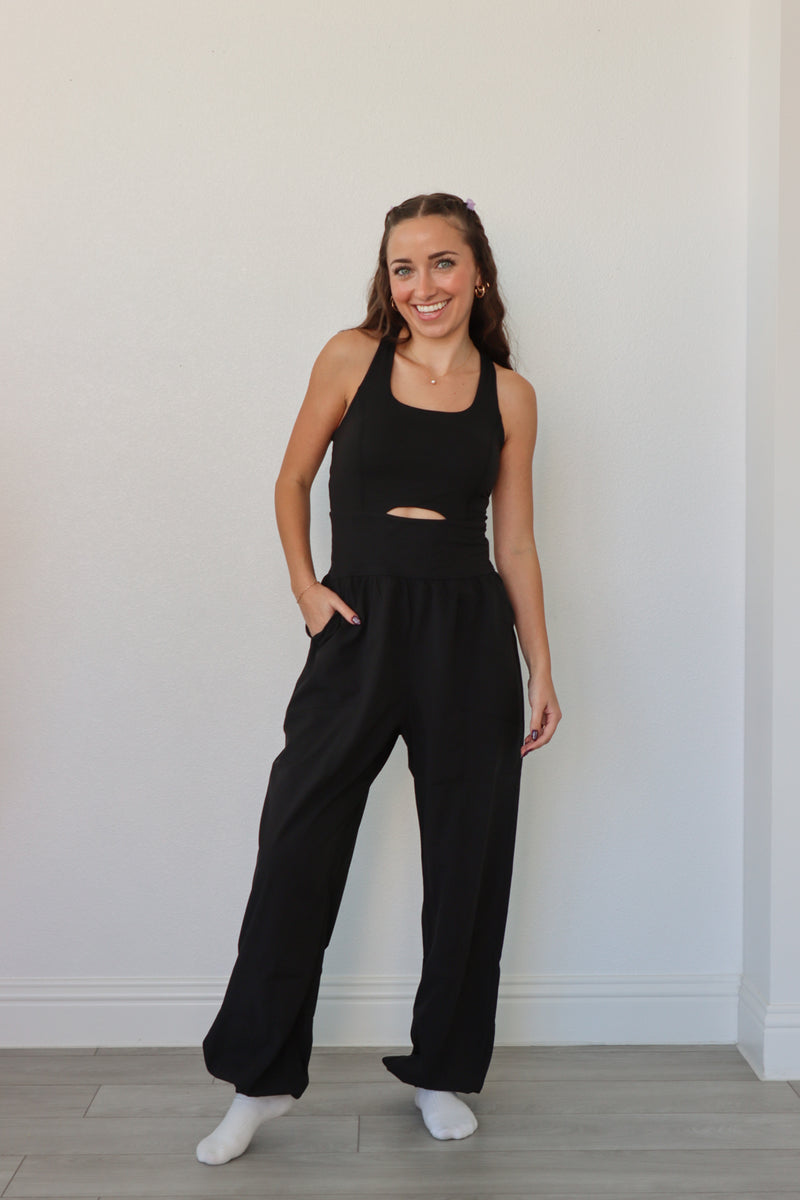 girl wearing black athletic jumpsuit