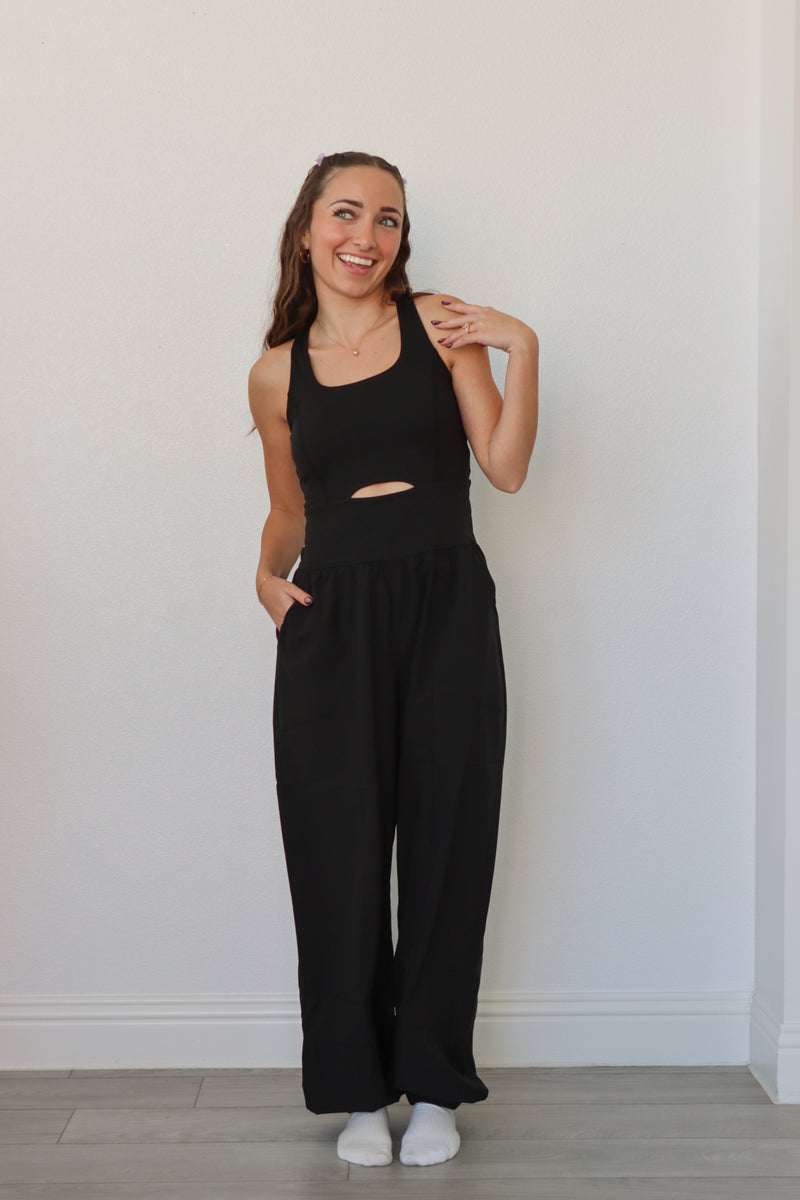 girl wearing black athletic jumpsuit