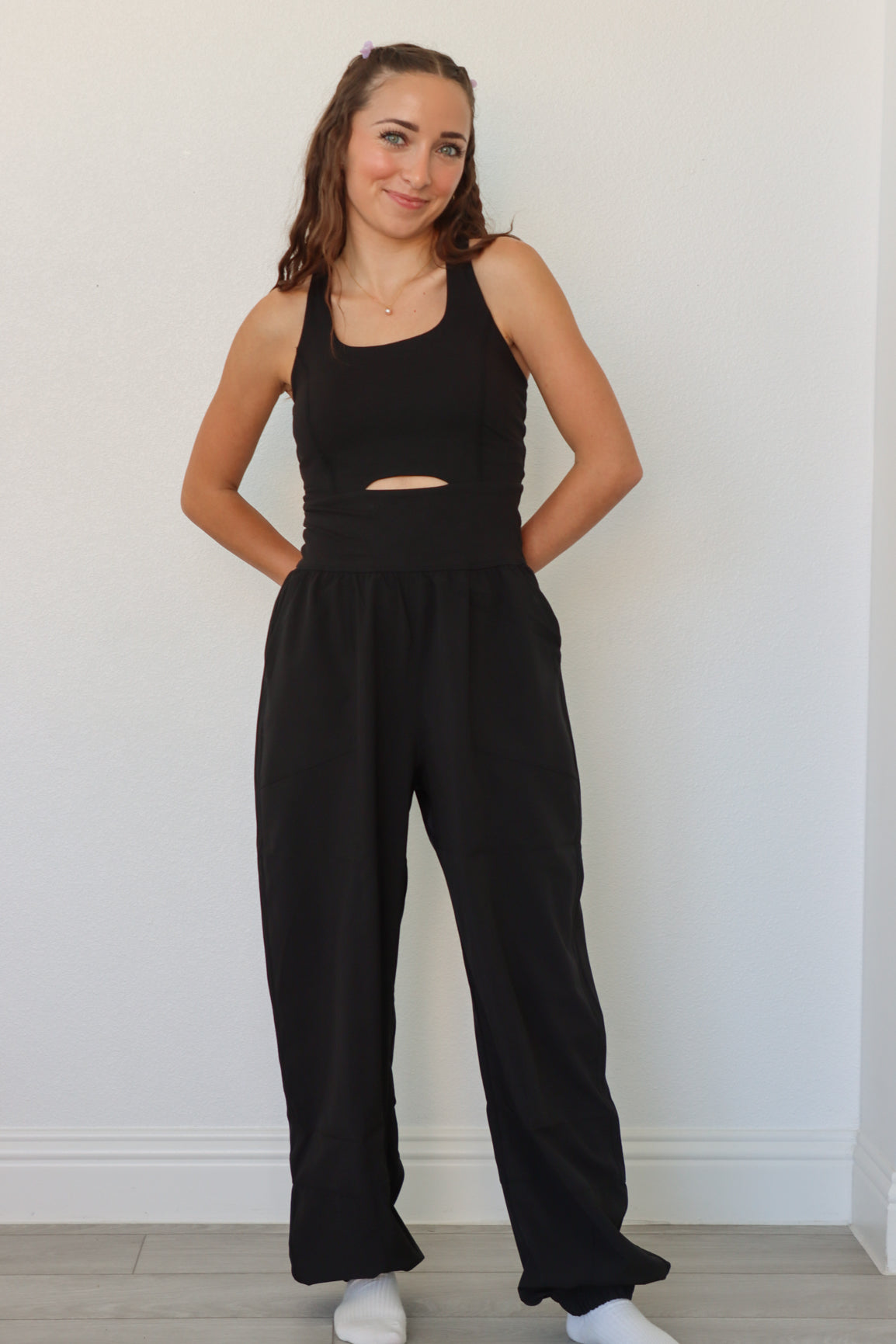 girl wearing black athletic jumpsuit