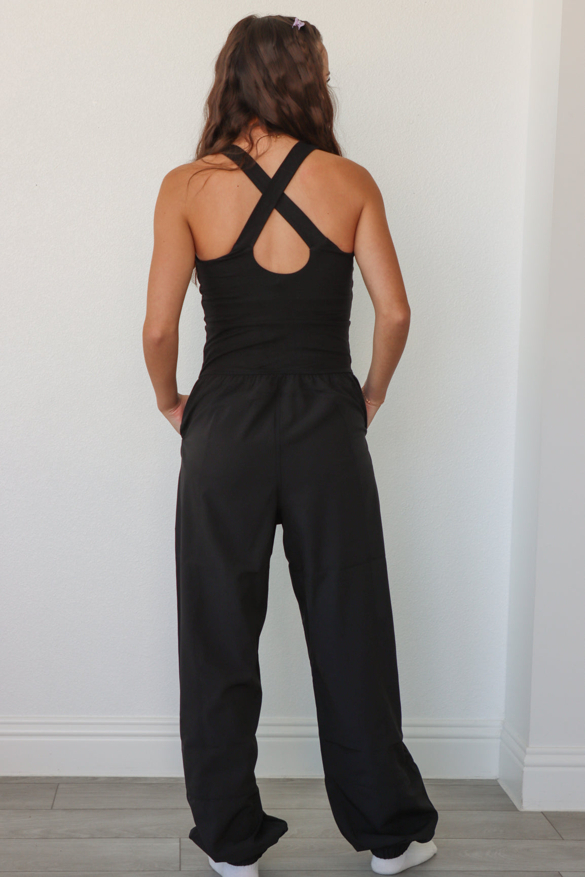 girl wearing black athletic jumpsuit