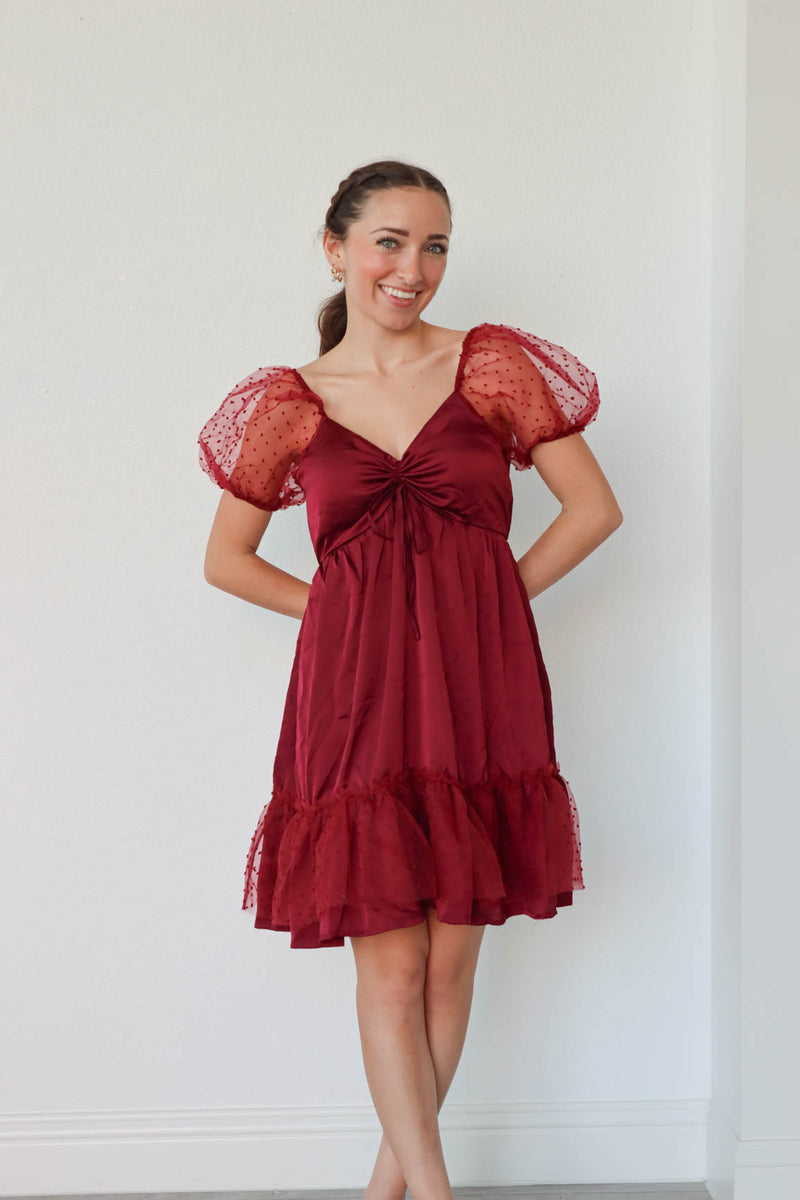 girl wearing red puff sleeved short dress