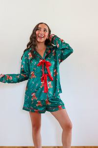 girl wearing dark green silk teddy bear pj set