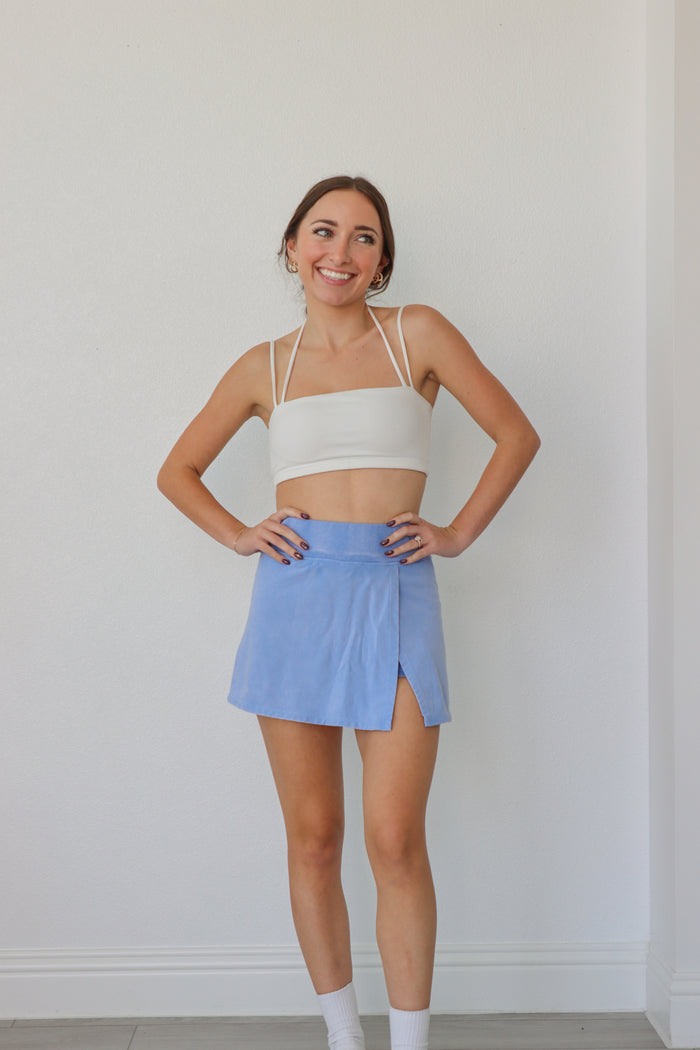 girl wearing periwinkle skort