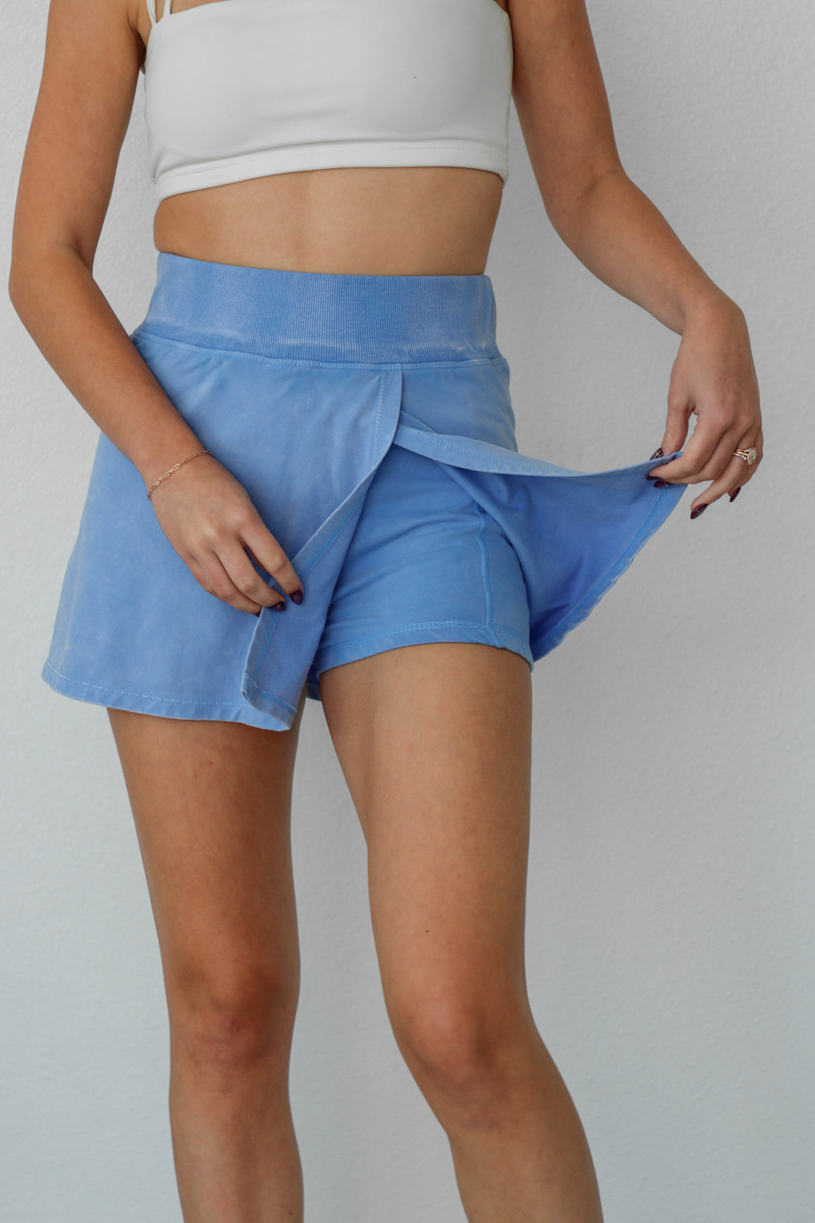 girl wearing periwinkle skort