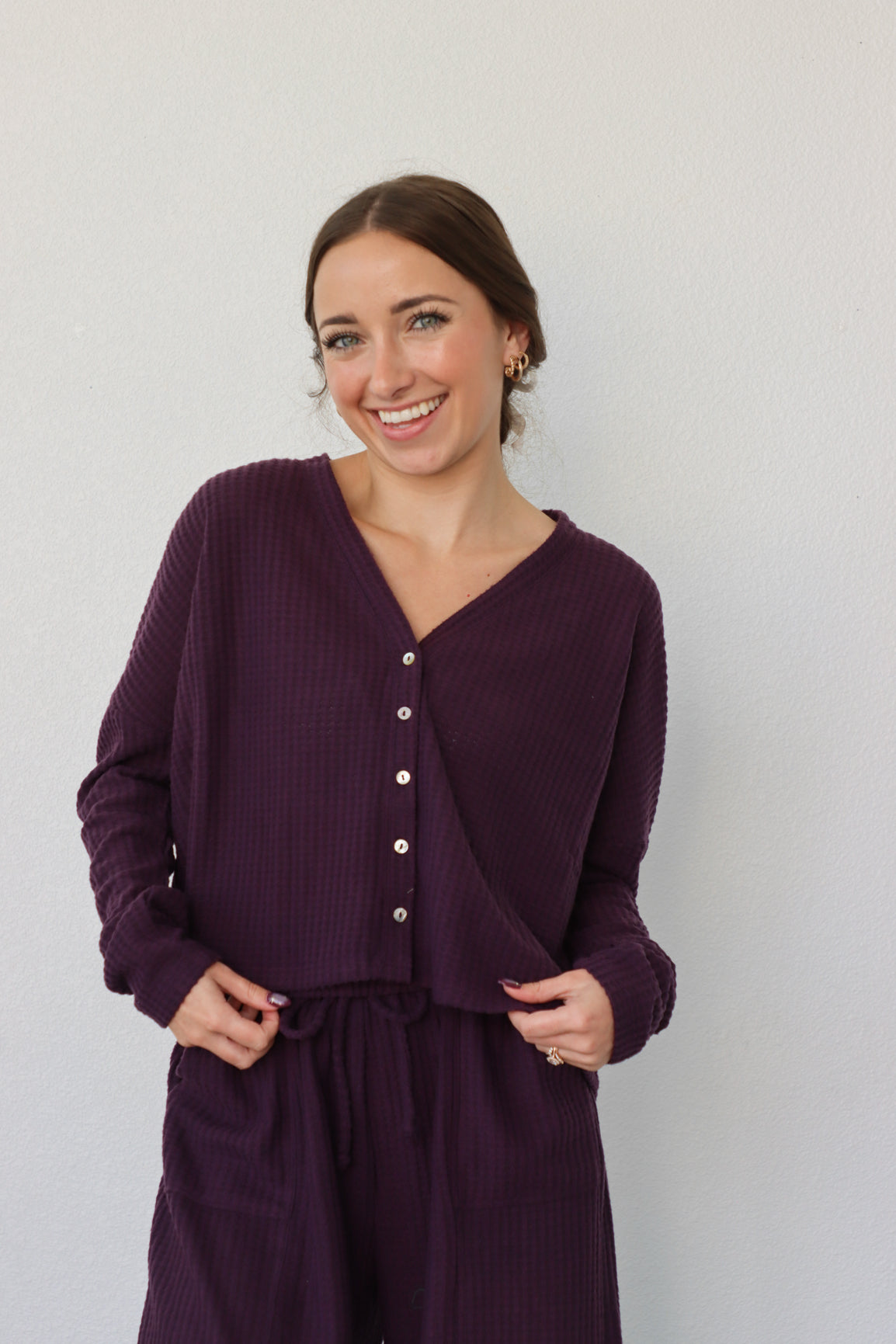 girl wearing dark purple waffle knit lounge set