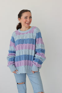 girl wearing blue and purple striped sweater