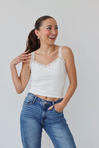 girl wearing white tank top with lace edges