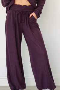 girl wearing dark purple waffle knit lounge set