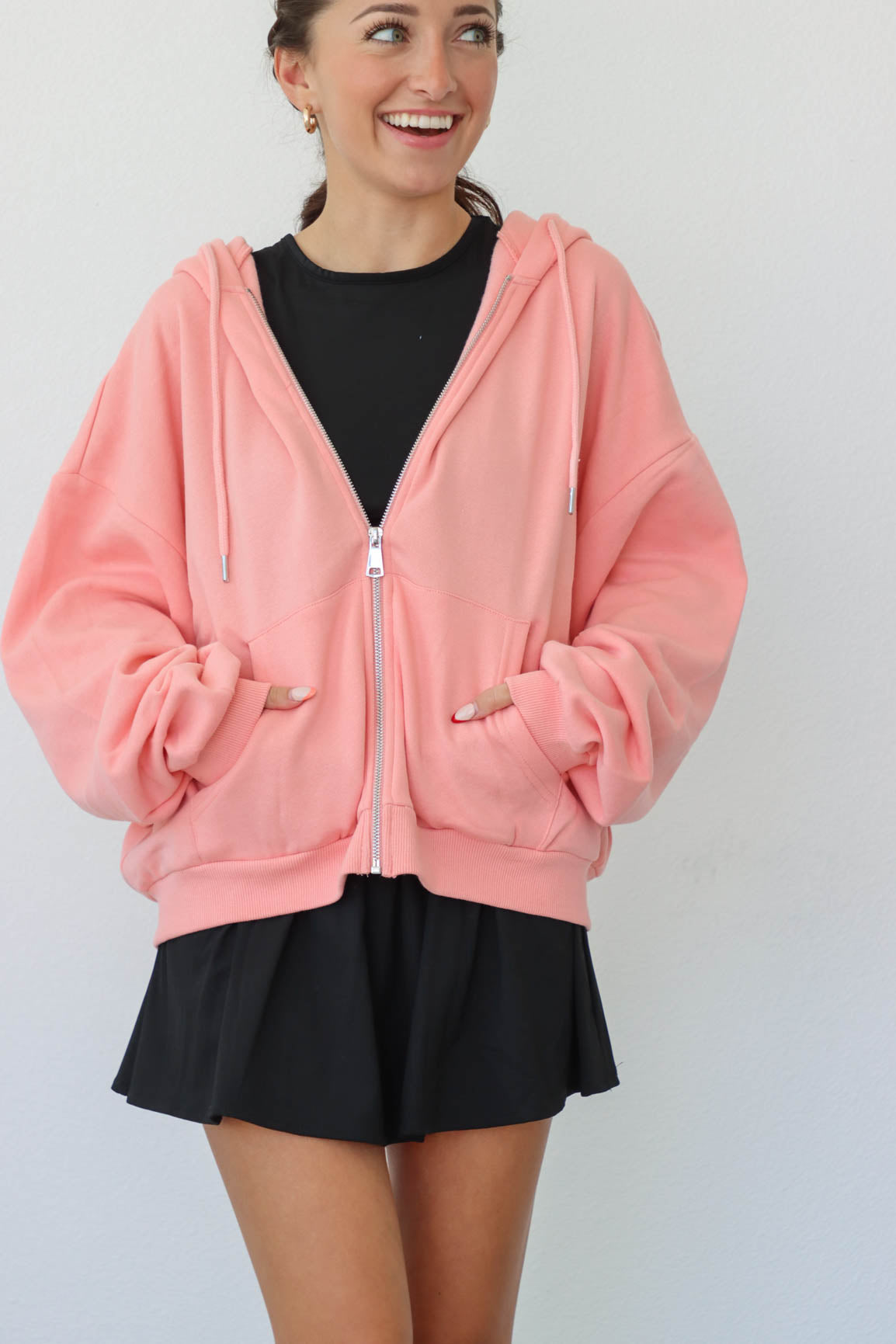 girl wearing pink hoodie
