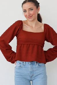 girl wearing deep red top