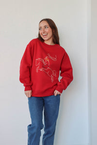 girl wearing red western embroidered crewneck