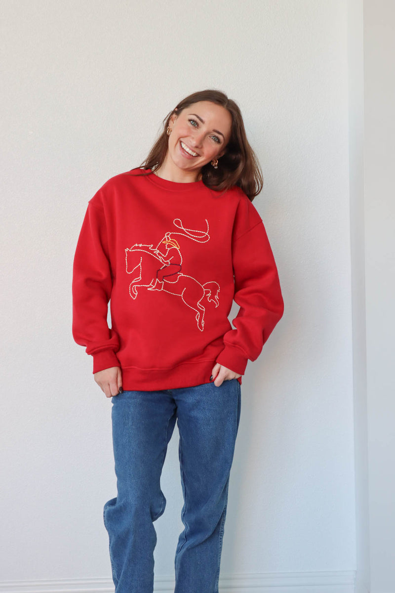 girl wearing red western embroidered crewneck