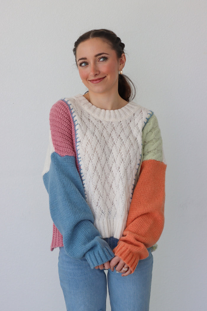girl wearing multicolor knit sweater