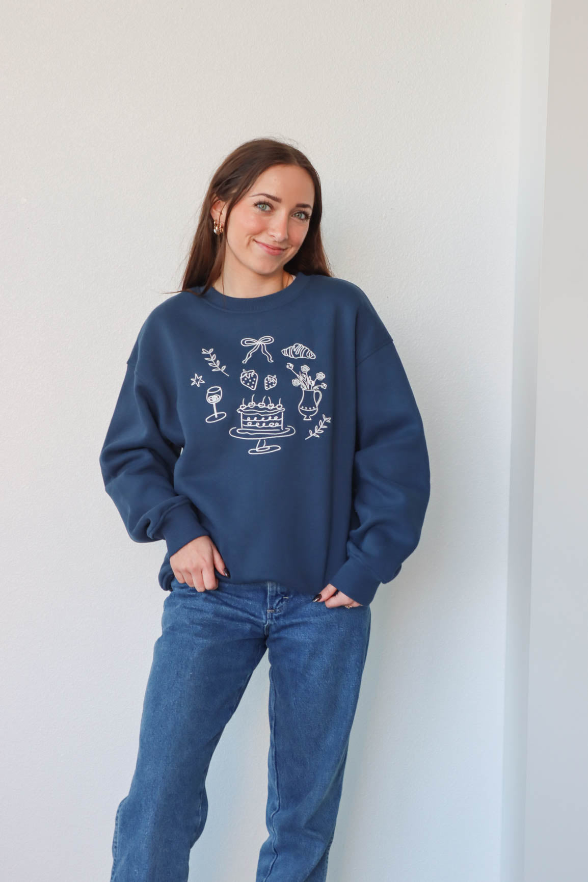 girl wearing navy blue crewneck sweatshirt