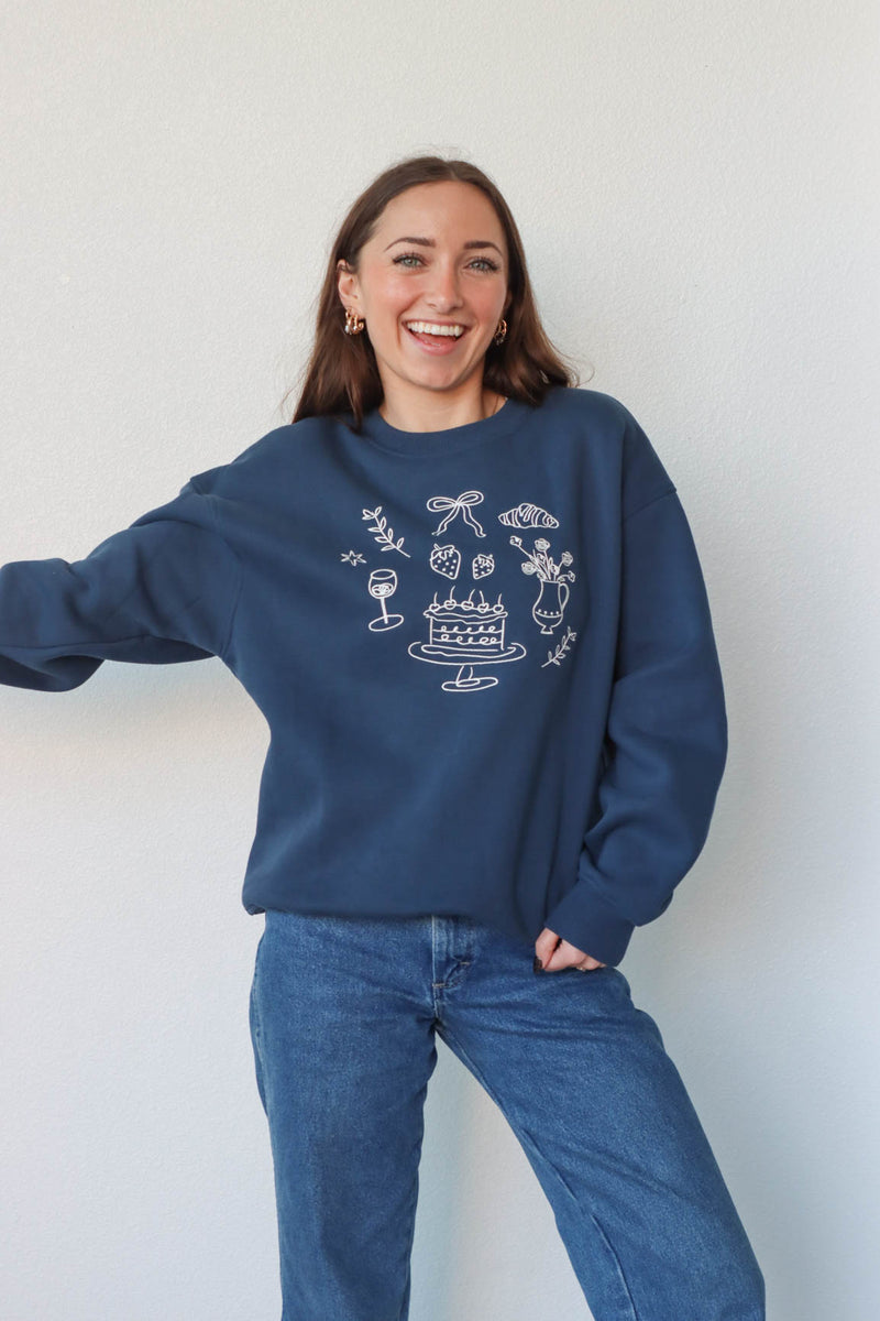 girl wearing navy blue crewneck sweatshirt