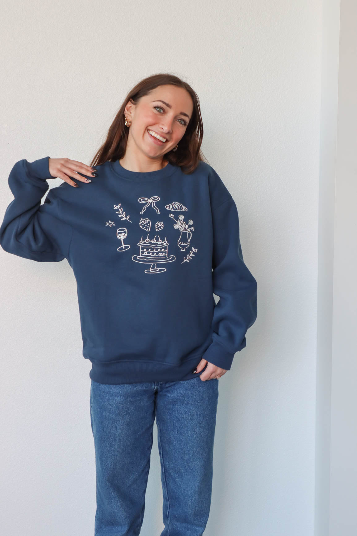 girl wearing navy blue crewneck sweatshirt