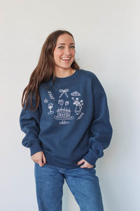 girl wearing navy blue crewneck sweatshirt