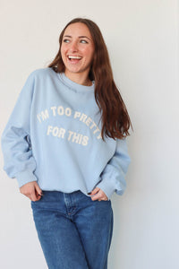 girl wearing light blue "i'm too pretty for this" crewneck