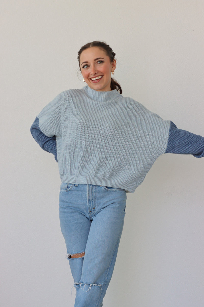 girl wearing blue & white colorblocked sweater