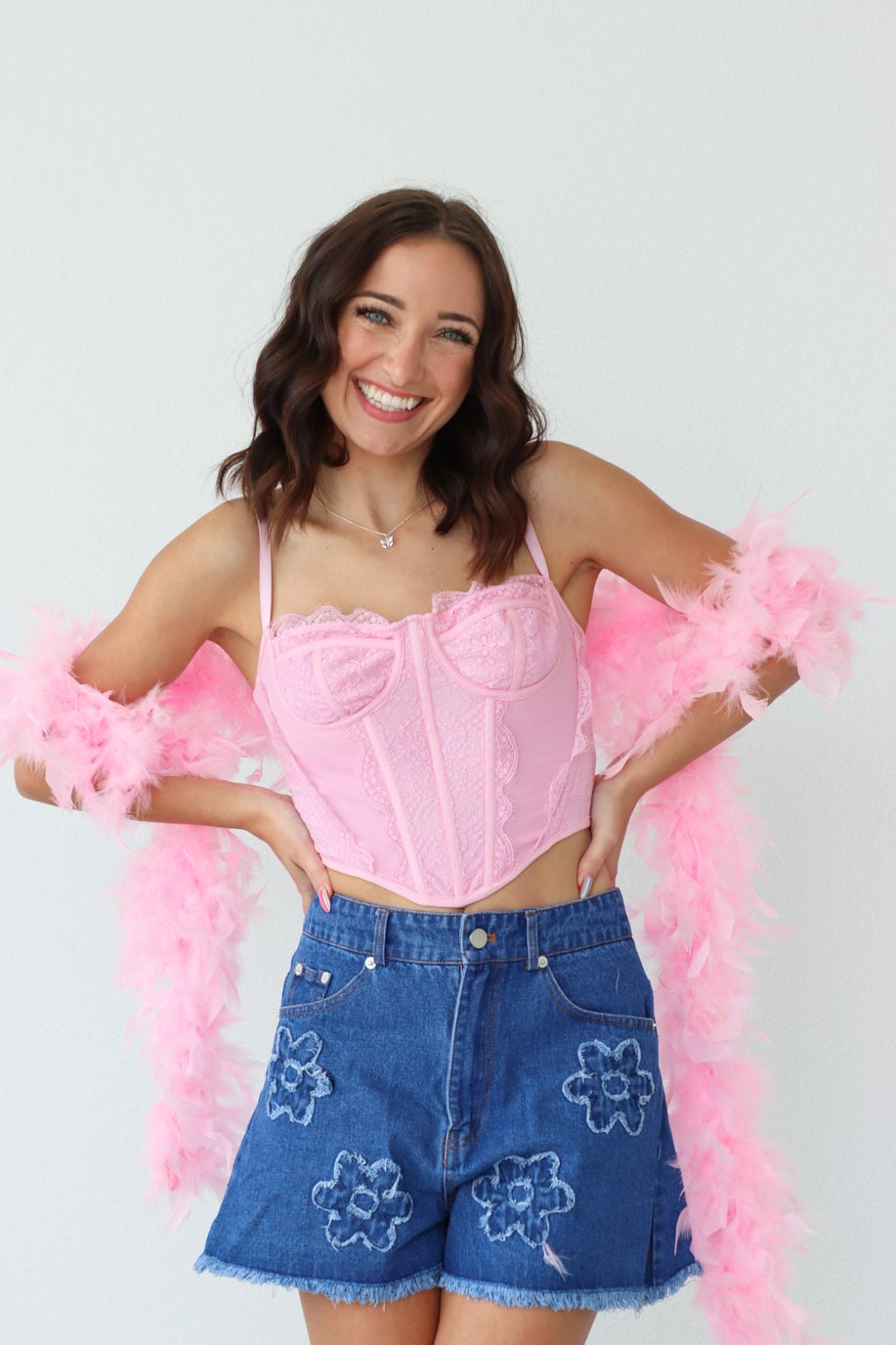girl wearing pink corset top