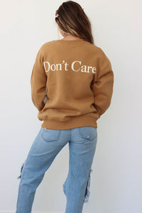 girl wearing color block sweatshirt with "Don't Know" on the front and "Don't Care" on the back