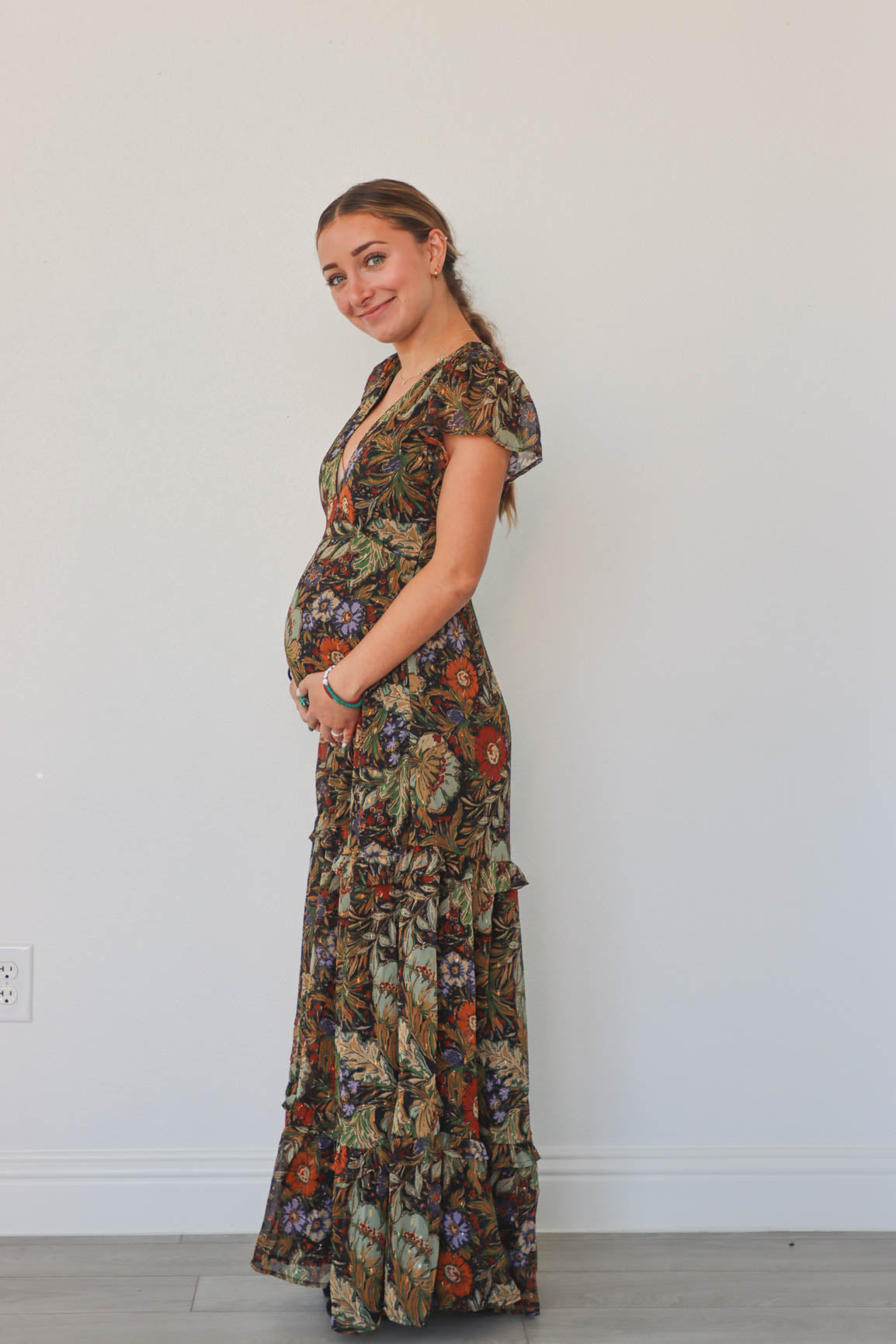 girl wearing black floral maxi dress