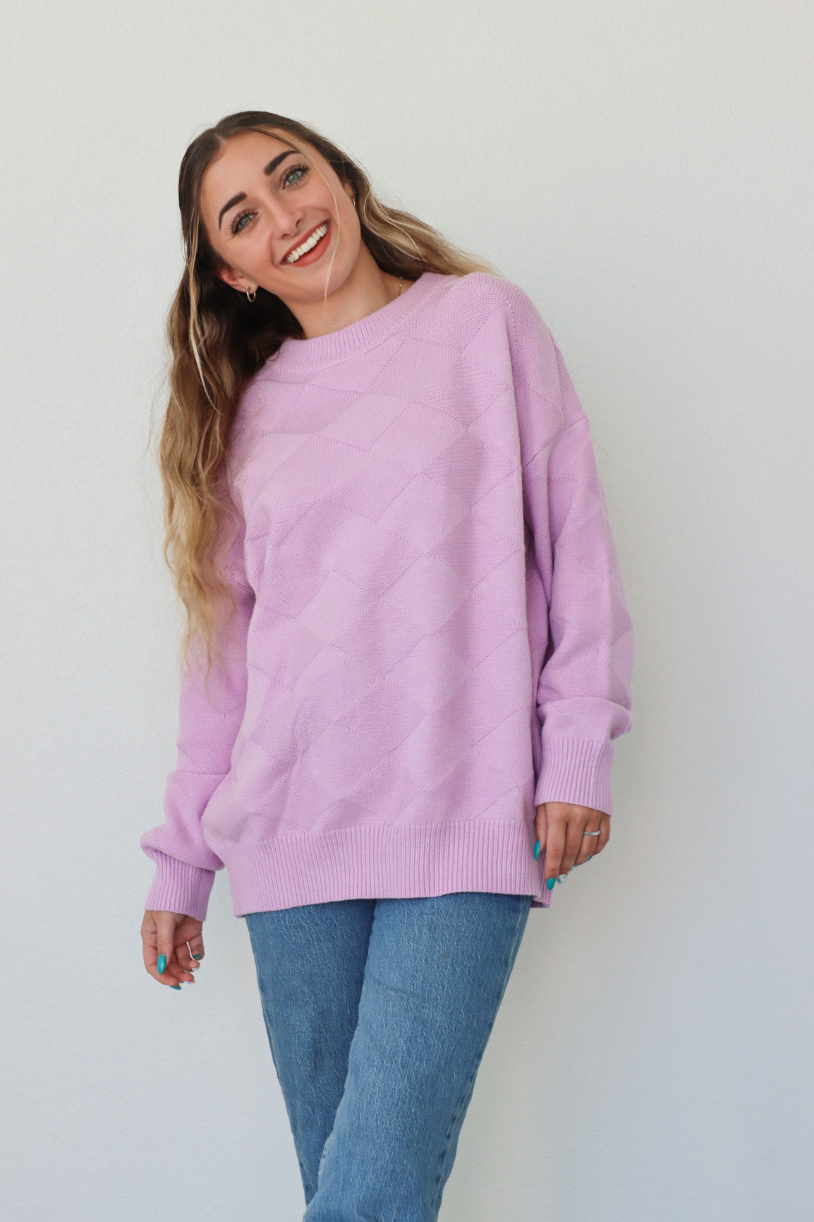 girl wearing lilac knit sweater