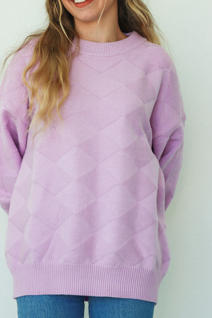 girl wearing lilac knit sweater