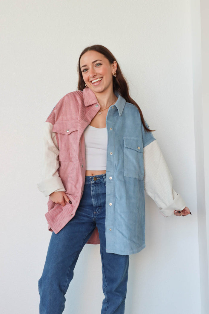 girl wearing pink, white, and blue pastel corduroy jacket