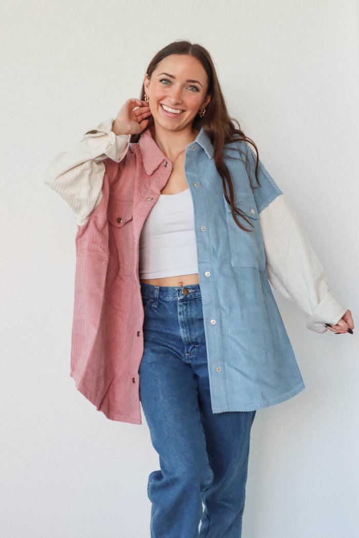 girl wearing pink, white, and blue pastel corduroy jacket