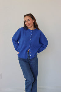 girl wearing royal blue cardigan