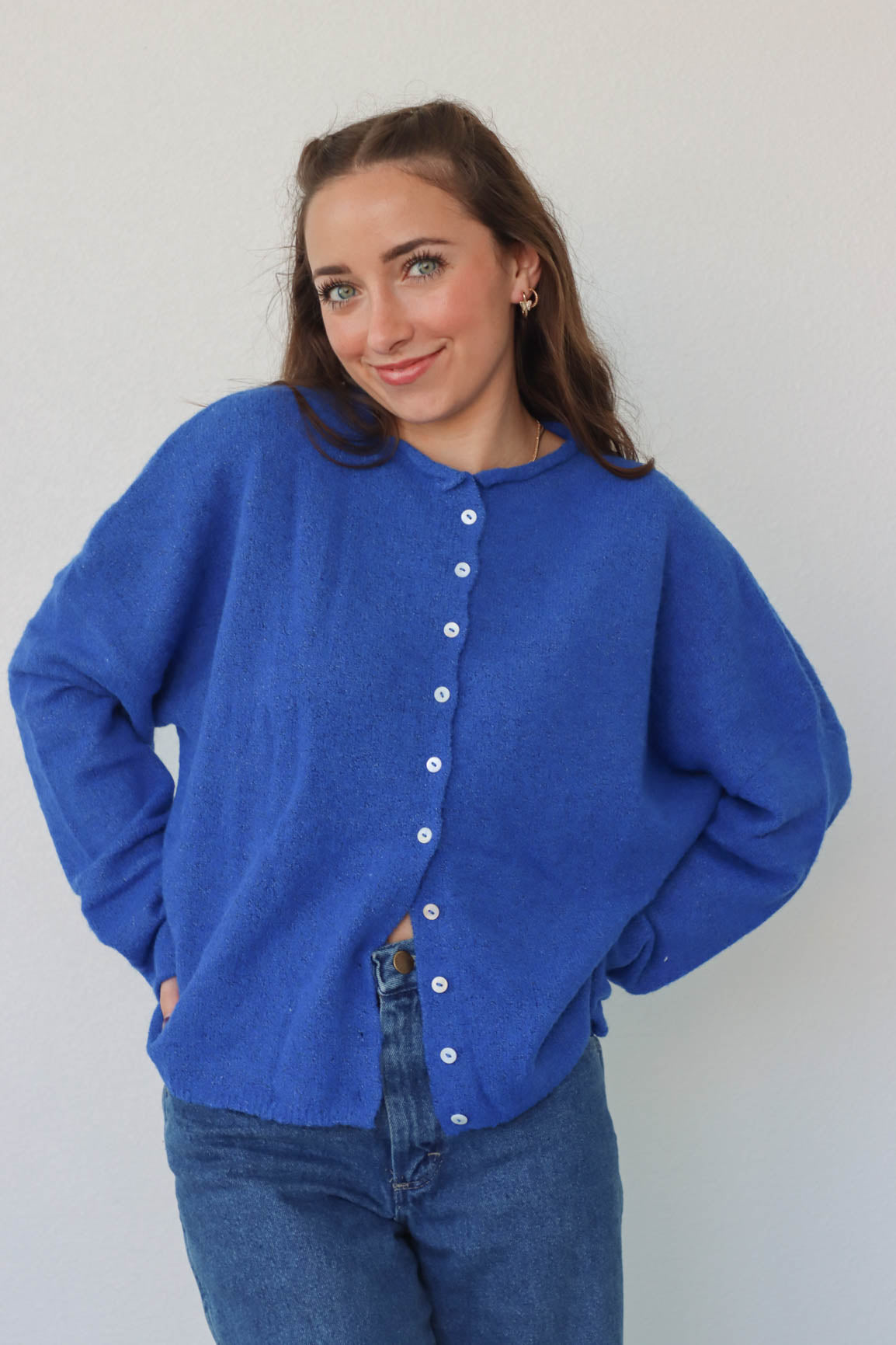 girl wearing royal blue cardigan