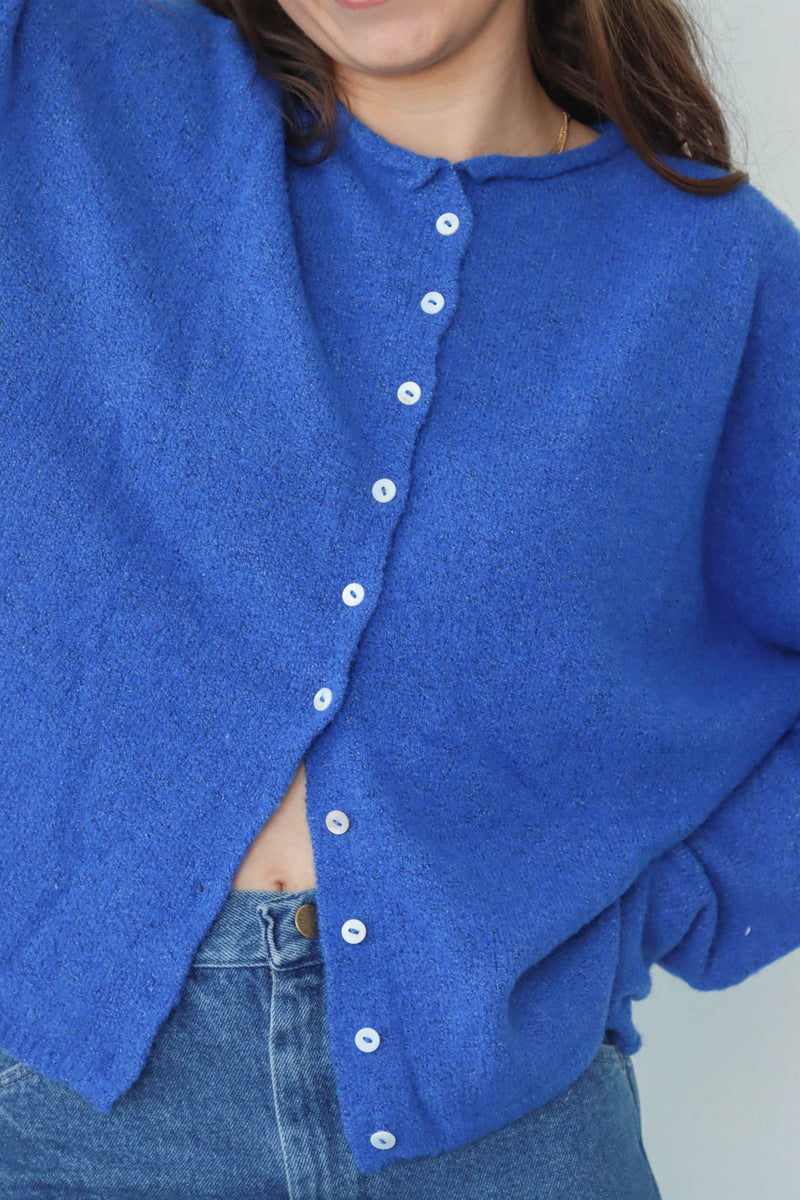 girl wearing royal blue cardigan