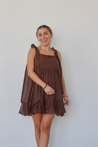 girl wearing dark brown short dress