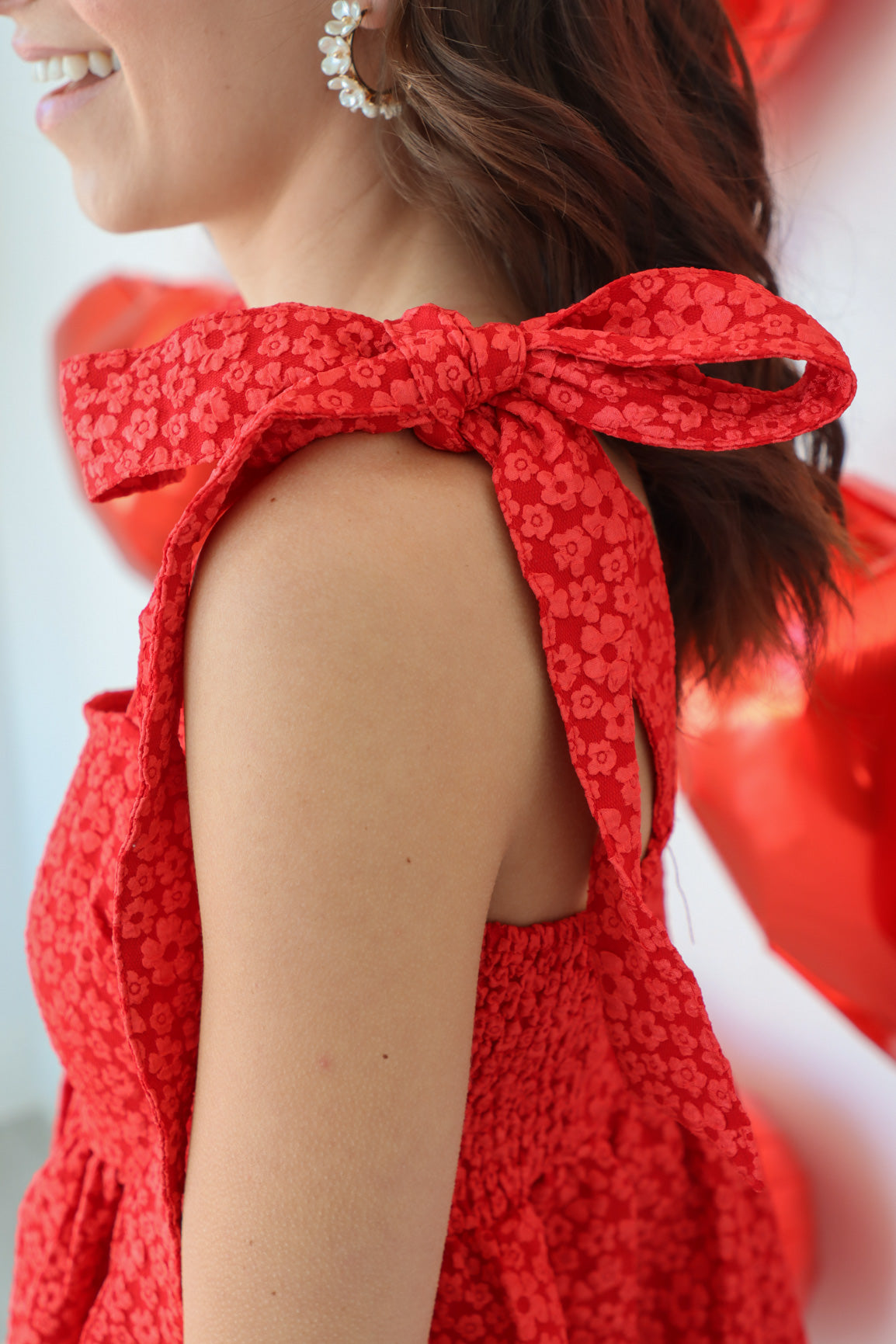 adjustable straps on red floral dress