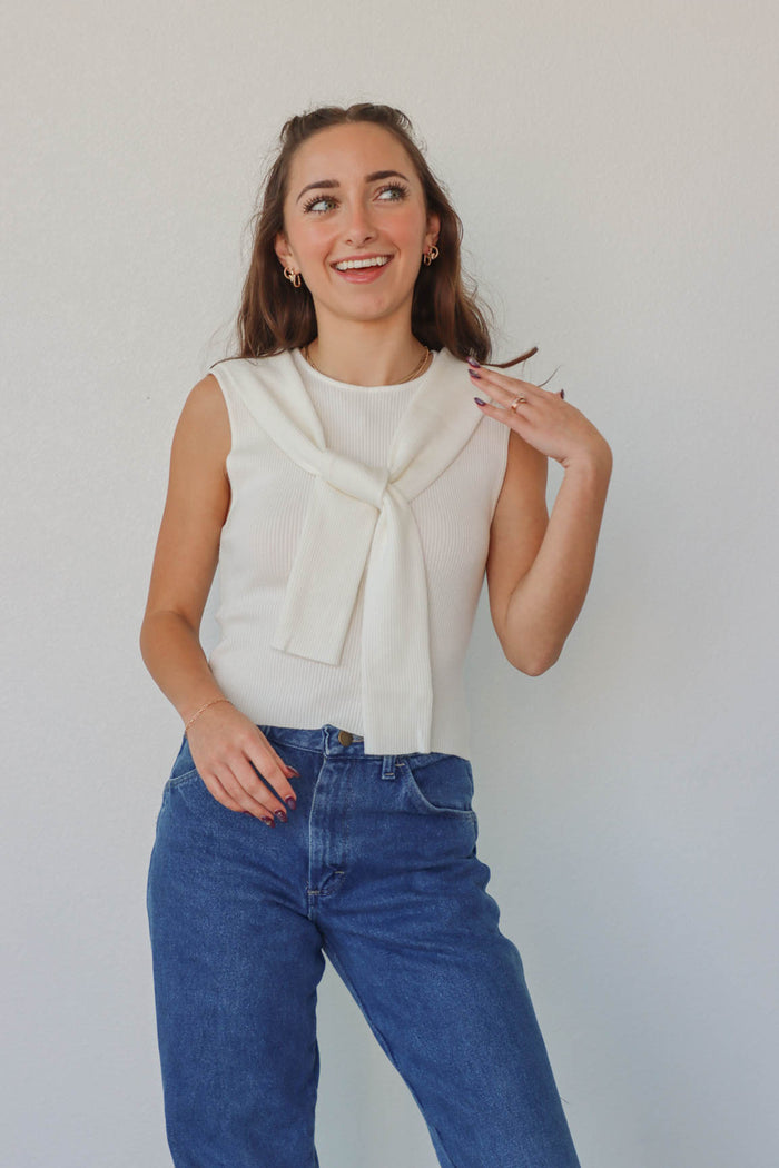 girl wearing white knit tank top