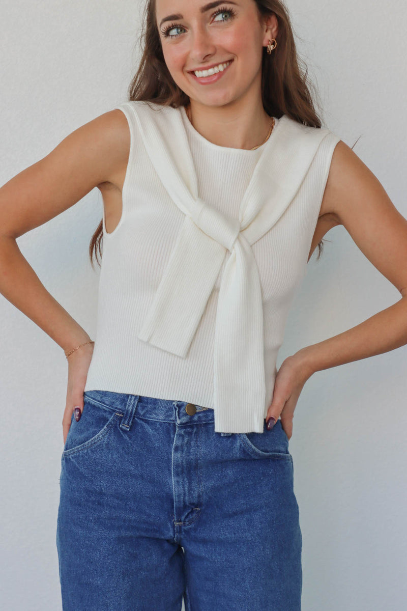 girl wearing white knit tank top