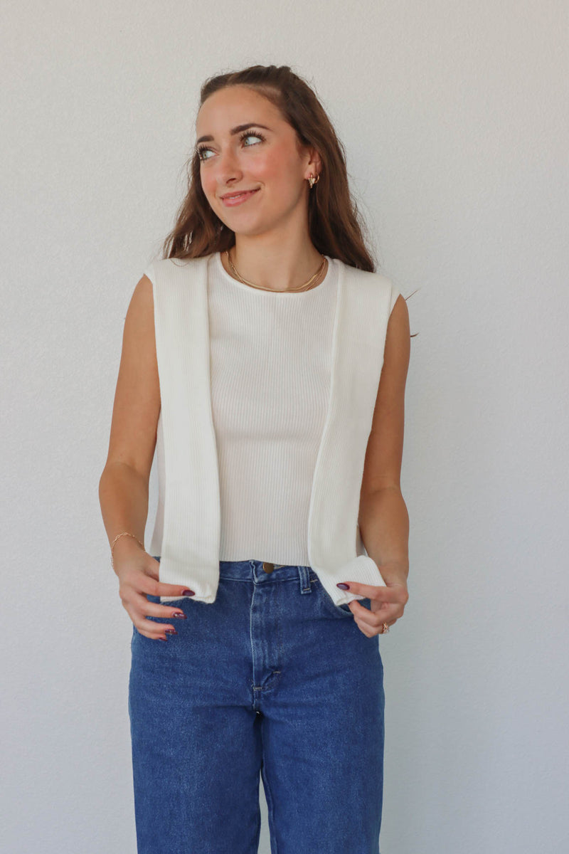 girl wearing white knit tank top